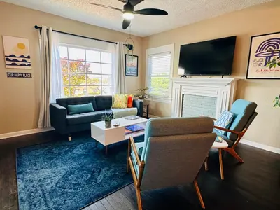 a living room with a couch and a table at 3-Bedroom, Prime Location, Private Backyard! in San Diego