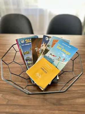 a rack of books sitting on a table at 3-Bedroom, Prime Location, Private Backyard! in San Diego