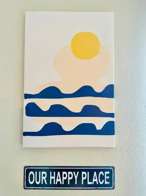 a sign hanging on a wall with a happy place at 3-Bedroom, Prime Location, Private Backyard! in San Diego