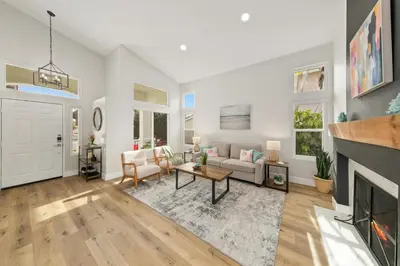 a living room with a couch and a fireplace at Good Vibes Cottage - Carlsbad-Vista-San Diego-Beach-Legoland in Vista
