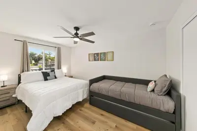 a bedroom with two beds and a ceiling fan at Good Vibes Cottage - Carlsbad-Vista-San Diego-Beach-Legoland in Vista