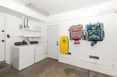 a kitchen with a yellow surfboard on the wall at Good Vibes Cottage - Carlsbad-Vista-San Diego-Beach-Legoland in Vista
