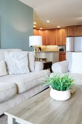 a living room with a couch and a table at Oceanside Beach Condos in Oceanside