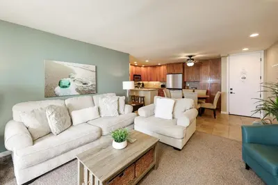 a living room with a couch and a table at Oceanside Beach Condos in Oceanside