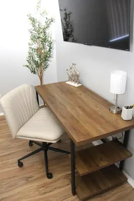 a dining room table with a chair and a television at San Diego Fun-Gameroom & Gazebo-Centrally Located! in San Diego
