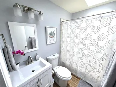 a bathroom with a shower and a toilet and a sink at San Diego Fun-Gameroom & Gazebo-Centrally Located! in San Diego