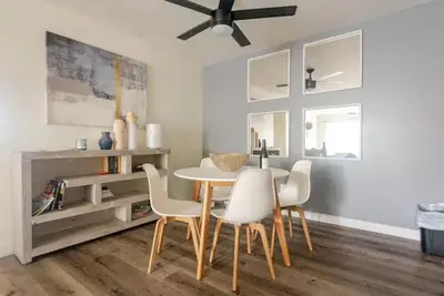 a dining room with a table and chairs at Resort Living with Pool & Tennis Minutes to Del Mar Beaches in San Diego