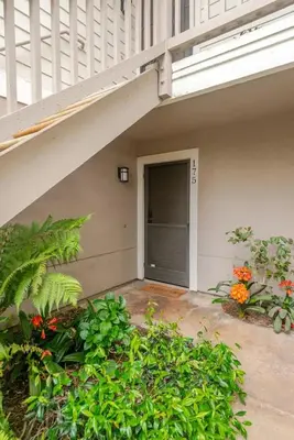 a garage with a door and some plants at Resort Living with Pool & Tennis Minutes to Del Mar Beaches in San Diego