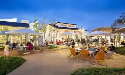 a group of people sitting in chairs under umbrellas at Resort Living with Pool & Tennis Minutes to Del Mar Beaches in San Diego