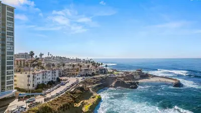 a view of a beach with buildings and the ocean at Waterfront Condo Unmatched Views and Prime Location in San Diego