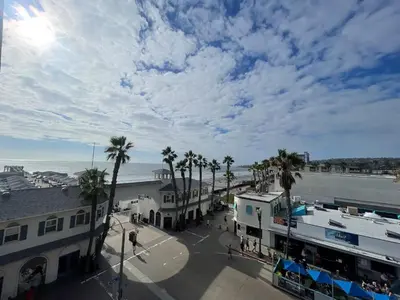 a view of a town with palm trees and the ocean at Penthouse at Pacific Beach Crystal Pier in San Diego
