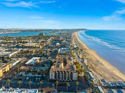 an aerial view of a beach and the ocean at Penthouse at Pacific Beach Crystal Pier in San Diego