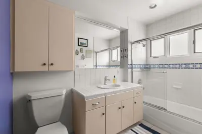 a bathroom with a toilet and a sink and a shower at Boho-Style Point Loma Retreat Large Outdoor Deck in San Diego