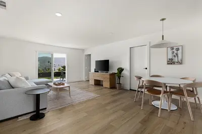 a living room with a couch and a table at Modern Escape w Mountain Views, Walk to Lake, Golf, Resort, Dining in San Marcos