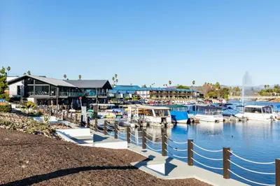 a group of boats docked at a marina at Modern Escape w Mountain Views, Walk to Lake, Golf, Resort, Dining in San Marcos
