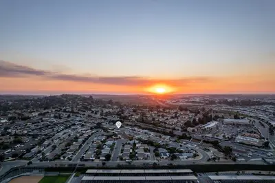 an aerial view of a city at sunset at Modern Escape w Mountain Views, Walk to Lake, Golf, Resort, Dining in San Marcos