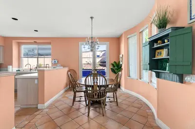 a kitchen and dining room with a table and chairs at Encinitas Retreat Private Pool and Spa Short Drive to Beach in Encinitas