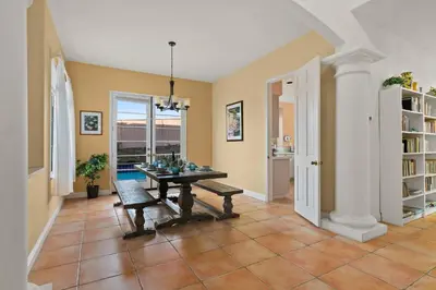a dining room with a table and a bench at Encinitas Retreat Private Pool and Spa Short Drive to Beach in Encinitas
