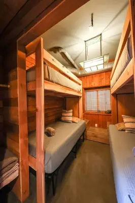 a bedroom with bunk beds in a cabin at Bamboo Loft 6BR, 24 guests in San Diego