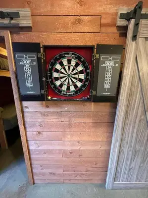 a dart board and two boxes on a wall at Bamboo Loft 6BR, 24 guests in San Diego