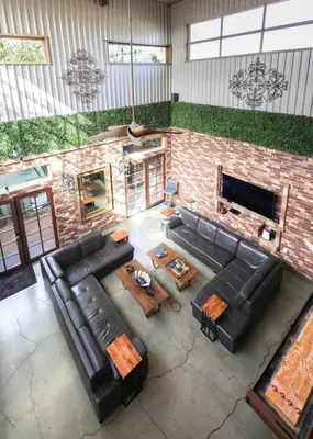 an overhead view of a living room with a brick fireplace at Bamboo Loft 6BR, 24 guests in San Diego