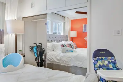 a mirror in a room with a bed and a bedroom at Coastal Escape King 1Bd, Pets Parking Fast Wi-Fi in San Clemente