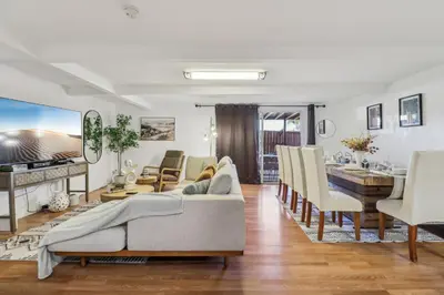 a living room with a couch and a table at Entire Private Home with 3 Bedrooms, Gated Yard, Parking, King Bed, Available Now in Spring Valley