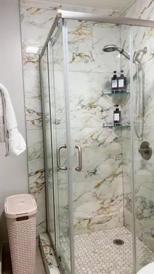 a shower with a glass door in a bathroom at Haven Vibe in Escondido