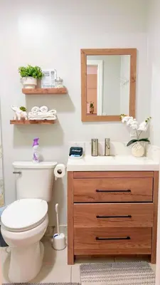 a bathroom with a toilet and a sink with a mirror at Haven Vibe in Escondido