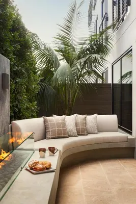 a living room with a couch and a fireplace at The Bower Coronado in San Diego