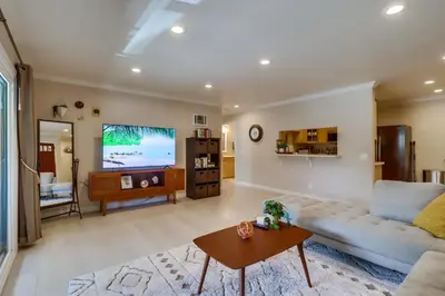 a living room with a couch and a tv at Entire Private Home with 3 Bedrooms 2 Bathrooms, Family Home Free Pool, Tub and Parking, Available Now in Chula Vista