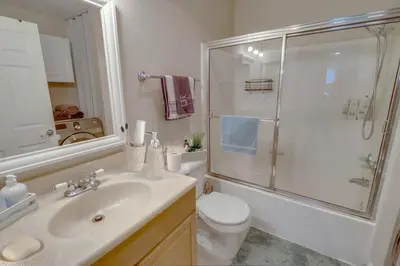 a bathroom with a sink and a shower and a toilet at Entire Private Home with 3 Bedrooms 2 Bathrooms, Family Home Free Pool, Tub and Parking, Available Now in Chula Vista