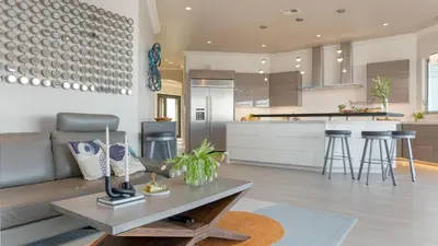 a living room and kitchen with a couch and a table at Summit Ranch by AvantStay Infinity Pool Views in Temecula