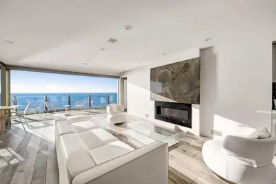 a living room with a view of the ocean at Hi-Tech Hideaway - Modern & Ocean Front! in Solana Beach