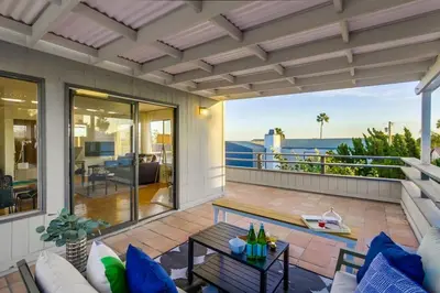 an outdoor patio with a view of the ocean at Beryl Bungalow in San Diego