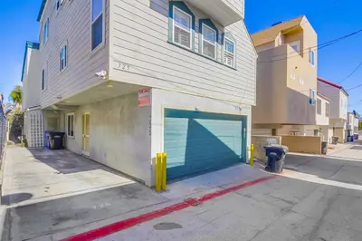 a building with a garage door with a fire hydrant at Coastal Haven in San Diego