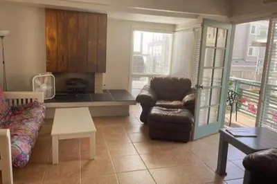 a living room with a couch and a chair at South Mission Oceanview Beach Duplex in San Diego