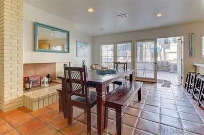 a dining room with a wooden table and chairs at South Mission Oceanview Beach Duplex in San Diego