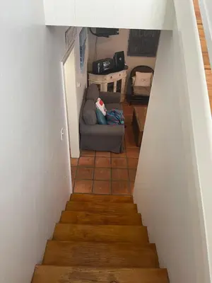 a stairway with a couch in a living room at South Mission Oceanview Beach Duplex in San Diego