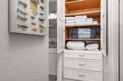 a closet with white drawers and towels at Bayfront 1-BR with Stunning View Steps to the Sand in San Diego