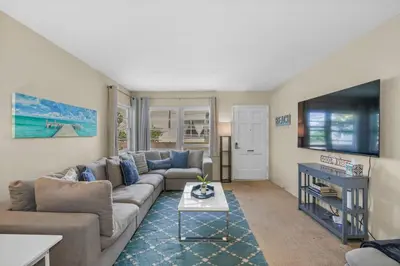 a living room with a couch and a table at 500 ft to Ocean Relaxing stay Parking WiFi 840 in San Diego