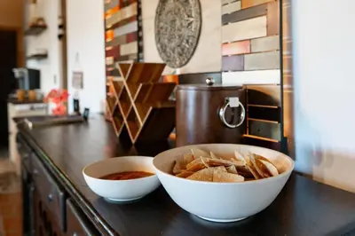 a counter with two bowls of food on a counter top at Mountain Majesty with AC BBQ Parking in Lemon Grove