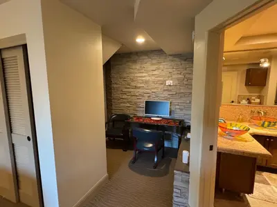 a room with a kitchen and a desk with a computer at Guesthouse in Coastal Del Mar, California in San Diego