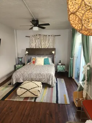a bedroom with a bed and a ceiling fan at Urban Beach Getaway 2 in San Diego