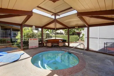 an outdoor pool with a pavilion with a pool table at Blissful SEA'renity - DMBC850S in Solana Beach