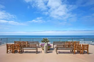 a row of benches sitting on a balcony overlooking the ocean at Second Wind - DMBC756S in Solana Beach