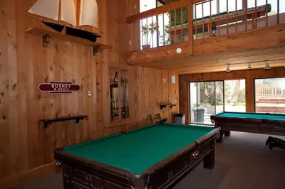 a pool table in a room with wooden walls at Above the Waves - SUR116 in Solana Beach
