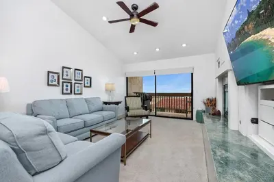 a living room with a couch and a ceiling fan at Paradise Found! - SBTC336 in Solana Beach