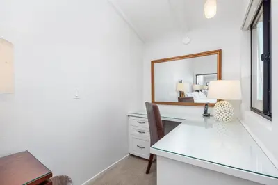 a desk with a mirror and a table with a chair at Paradise Found! - SBTC336 in Solana Beach