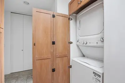 a wooden door in a kitchen with a washer and dryer at Paradise Found! - SBTC336 in Solana Beach